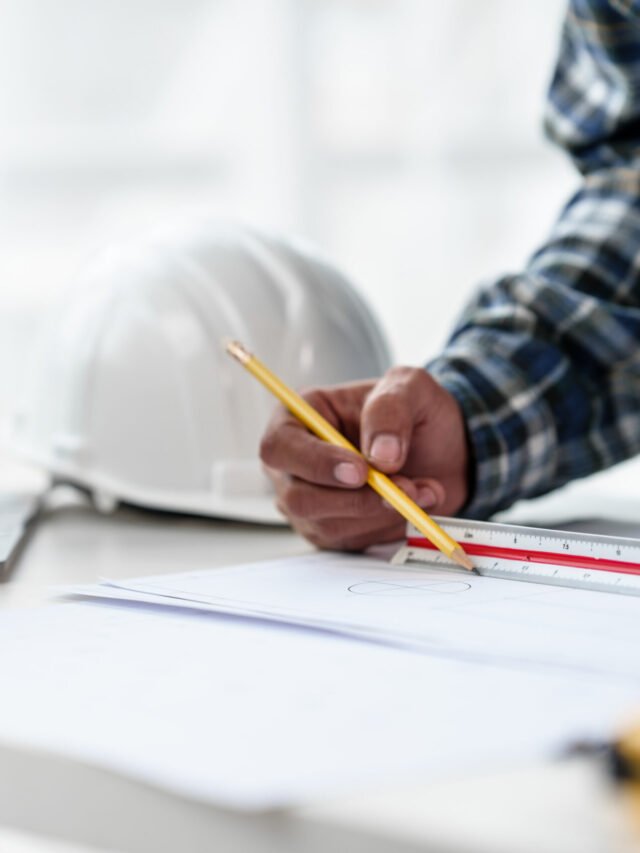 Architect engineer drawing plan blueprint of condominium or apar